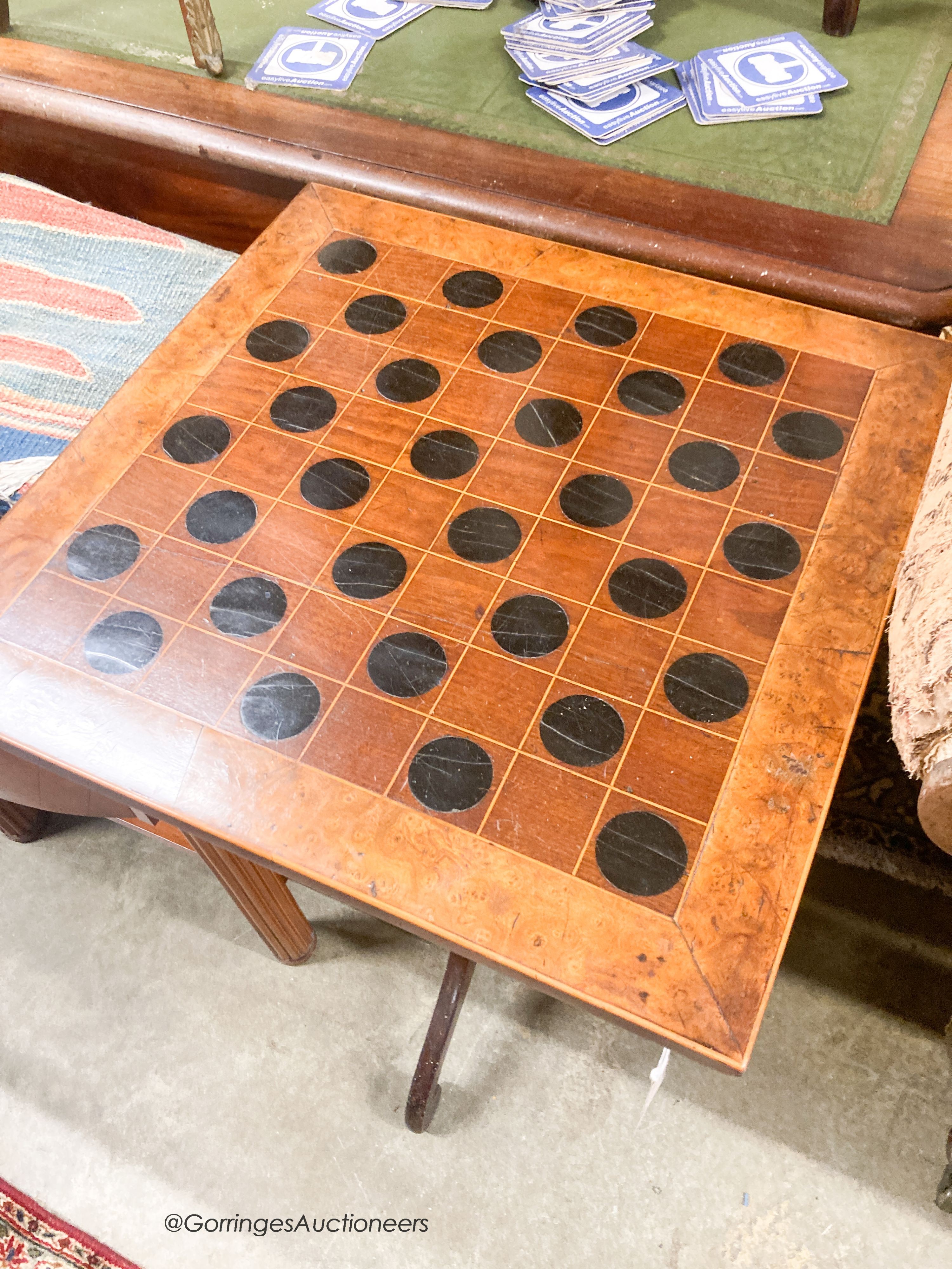 An early 19th century mahogany games top tripod table, width 51cm, depth 51cm, height 77cm